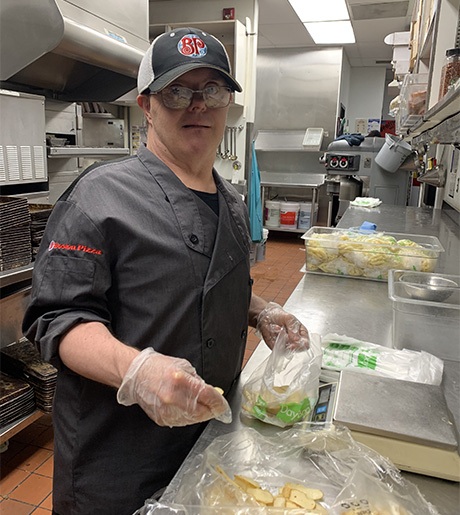 Paul at work in Boston Pizza kitchen